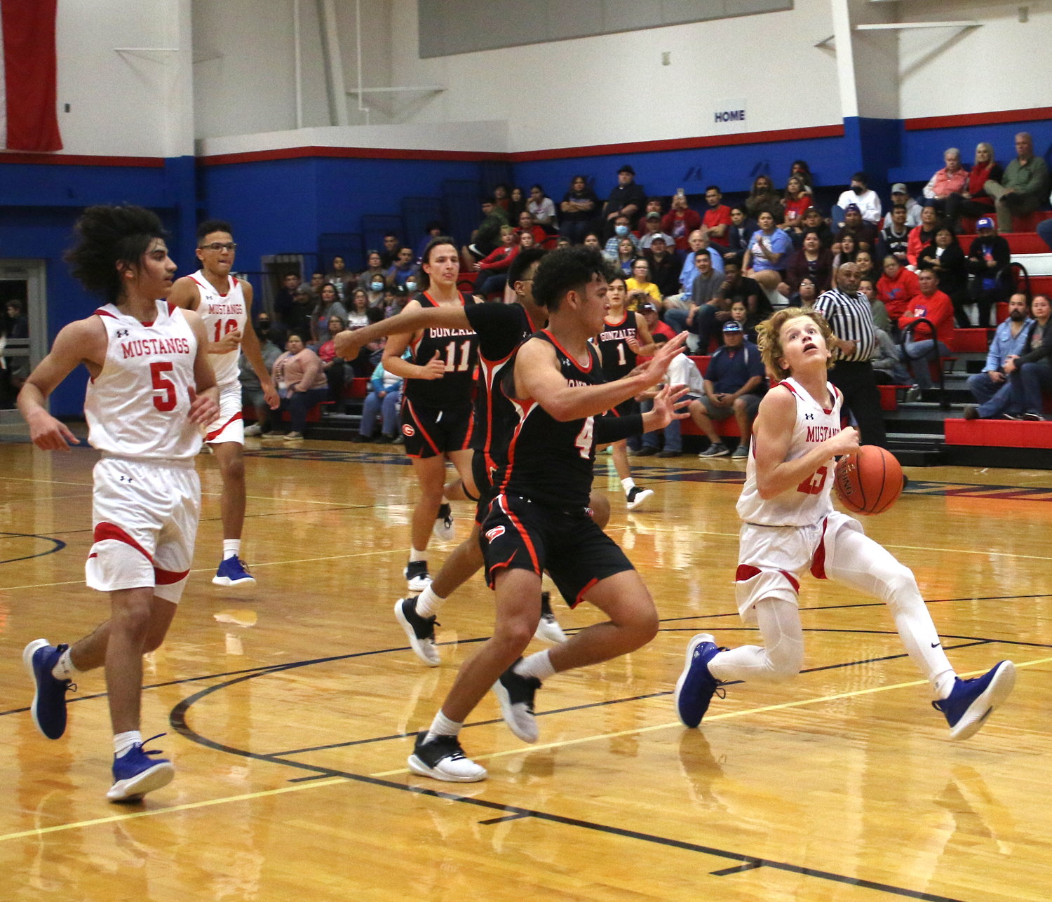 Luke Moses eyes the basket on a fast break while getting trailing support from Dustin Mejia and Braxton Regalado against Gonzales. Moses scored nine against Pettus, while Mejia had eight and Regalado had seven on Friday, Dec. 17.